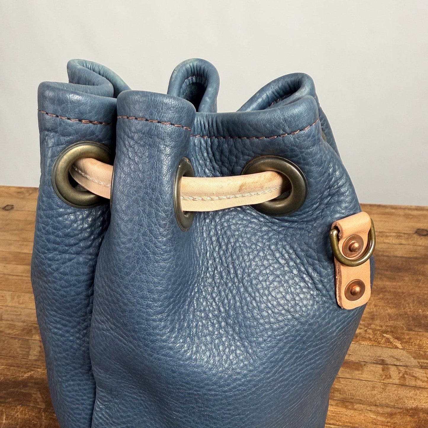 LEATHER BUCKET BAG - MEDIUM - SMOKEY BLUE - NATURAL STRAPS - WATER DAMAGE IN SHIPMENT - NEARLY PERFECT - IN STOCK